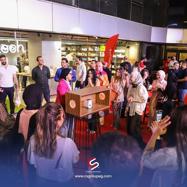 a group of people standing around a podium event echotech