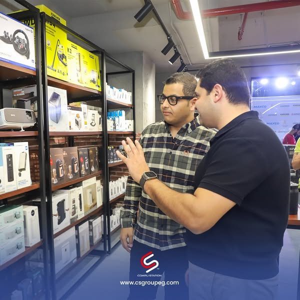 a group of men standing in a store echotech